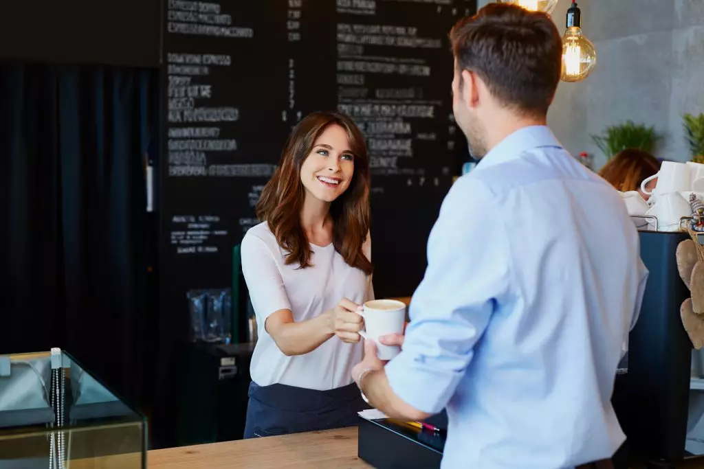 A barista providing excellent customer service.